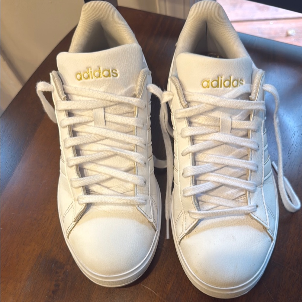adidas White Athletic Shoes with Gold Accents
